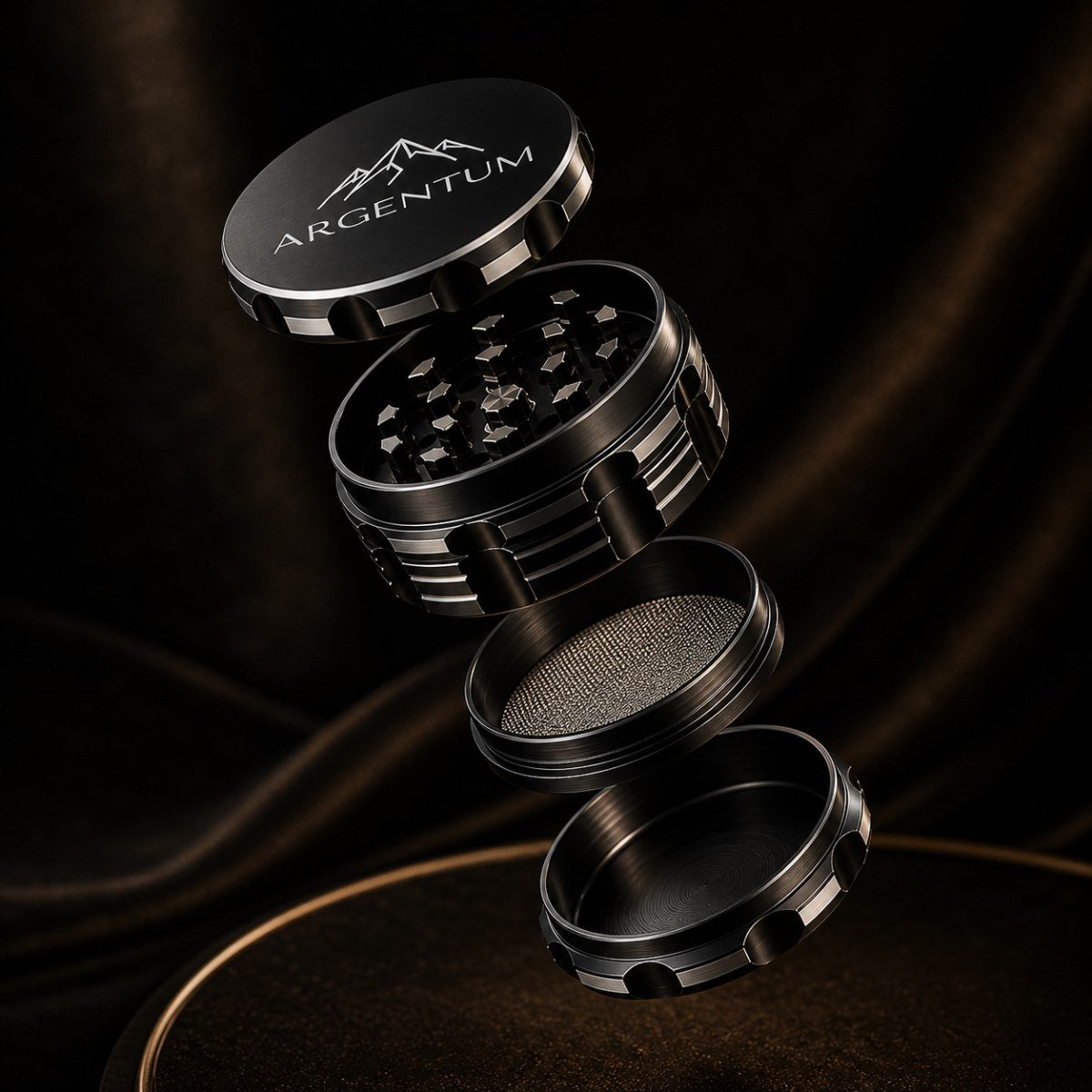 The four pieces of the ARGENTUM grinder separated, showing the three internal chambers