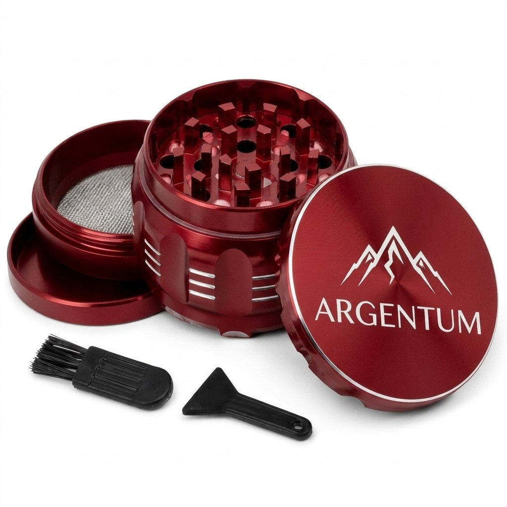 ARGENTUM grinder in the red anodized finish, disassembled with cleaning brush and scraper